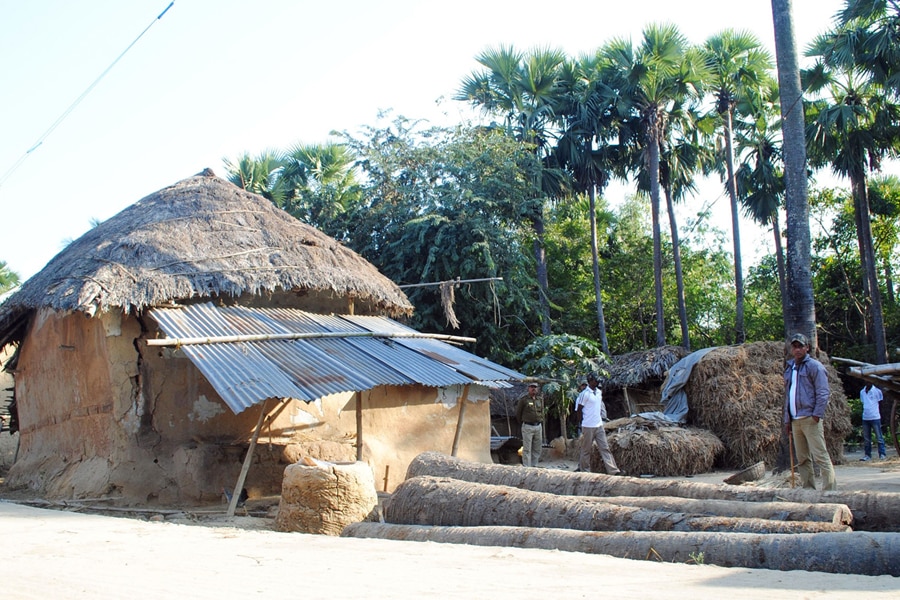 Policemen inspect the site where a woman was gang raped, allegedly on the direction of a village council at Subalpur village, in Birbhum district