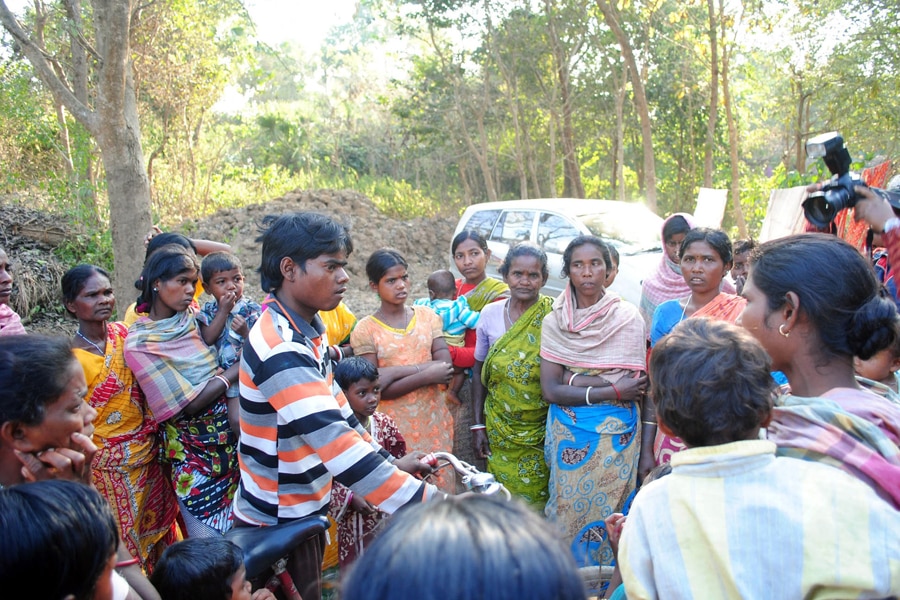 Santhal tribal women gather in a village where a woman was gang raped