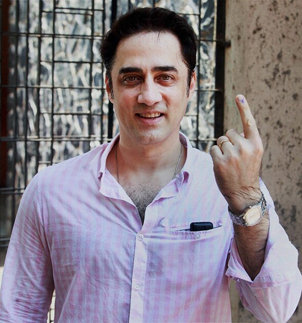 Bollywood actor Faizal Khan shows his inked finger after casting his vote for Lok Sabha polls in Mumbai.