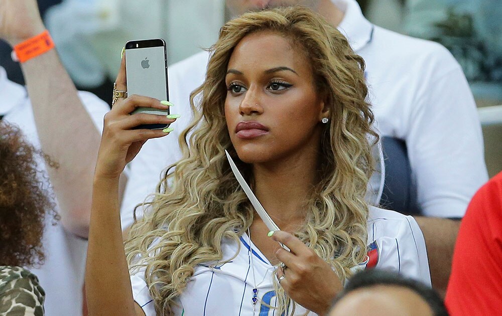 Belgian Fanny Neguesha, Mario Balotelli's girlfriend, attends at the group D World Cup soccer match between England and Italy at the Arena da Amazonia in Manaus, Brazil.
