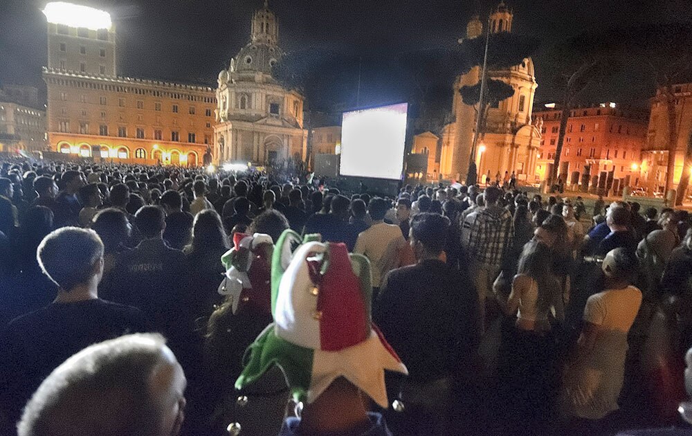 Tens of thousands gather in downtown Rome to watch on a giant screen the group D World Cup soccer match between England and Italy playing at the Arena da Amazonia in Manaus, Brazil.