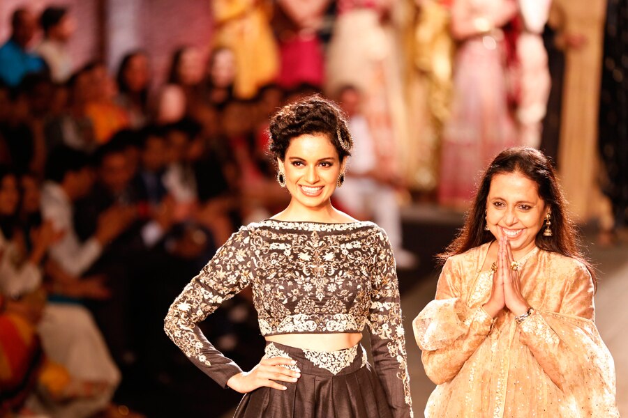 ndian actor Kangana Ranaut displays a dress created by Indian designer Anju Modi at the India Couture Week, held by Fashion Design Council of India, in New Delhi, India,  (AP Photo/Saurabh Das)