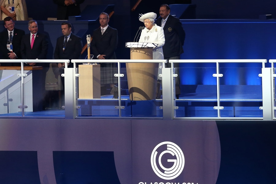 Britain's Queen Elizabeth II reads the message from the Queen's baton during the opening ceremony for the Commonwealth Games 2014 in Glasgow, Scotland