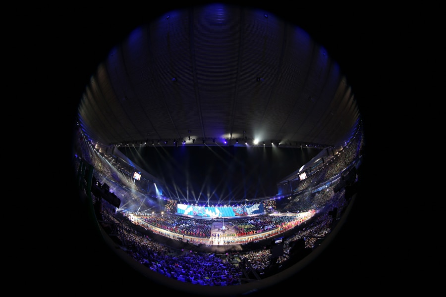 An image taken with a fisheye lens shows a general view of the stadiums as the teams march in during the opening ceremony 