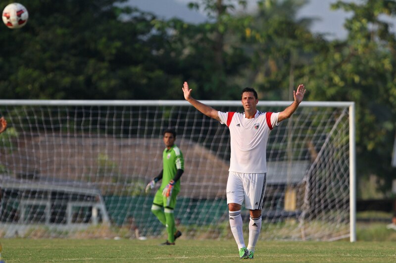 Spanish footballer Joan Capdevila who plays for the NorthEast United club in the upcoming Indian Super League (ISL) gestures during a practice match in Gauhati, India