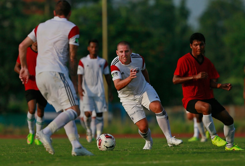 Spanish footballer Sergio Contreras Pardo, second right, who plays for the NorthEast United club in the upcoming Indian Super League (ISL) advances during a practice match in Gauhati