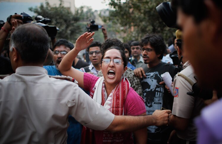 Women kiss each other to express support to the 'Kiss of Love’ campaign near the Hindu right-wing Rashtriya Swayamsevak Sangh (RSS) headquarters in New Delhi.
