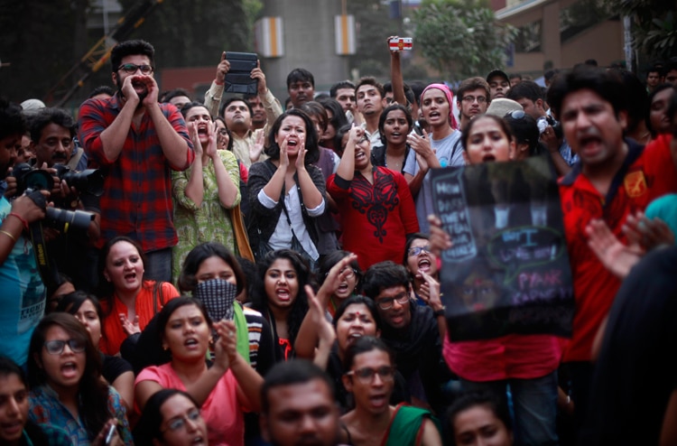 Women kiss each other to express support to the 'Kiss of Love’ campaign near the Hindu right-wing Rashtriya Swayamsevak Sangh (RSS) headquarters in New Delhi.
