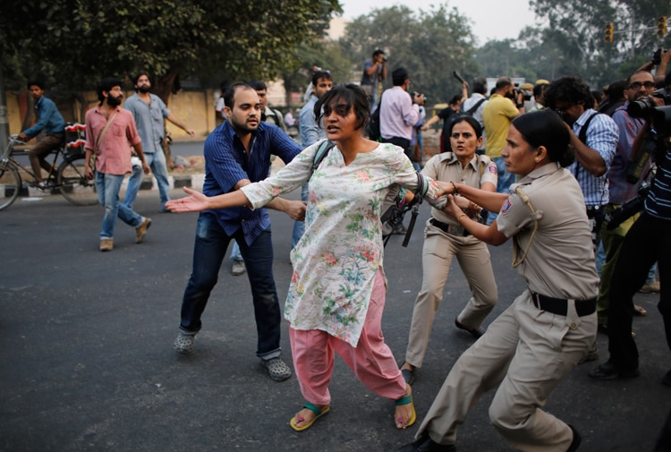 Women kiss each other to express support to the 'Kiss of Love’ campaign near the Hindu right-wing Rashtriya Swayamsevak Sangh (RSS) headquarters in New Delhi.
