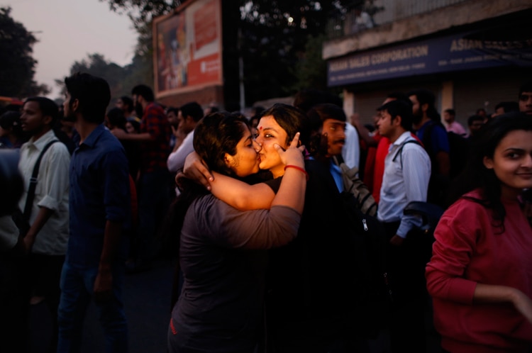 Women kiss each other to express support to the 'Kiss of Love’ campaign near the Hindu right-wing Rashtriya Swayamsevak Sangh (RSS) headquarters in New Delhi.
