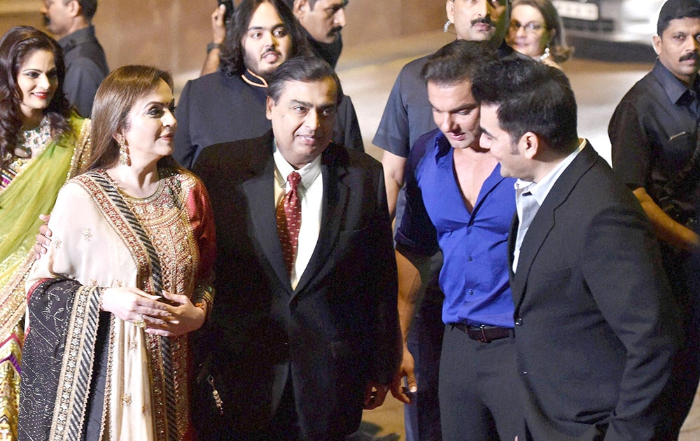 Mukesh Ambani with wife Neeta Ambani and son during the wedding reception of Arpita Khan and Aayush Sharma in Mumbai.