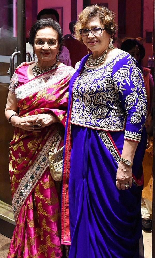 Bollywood veteran Actress Helen and Asha Parekh during the wedding reception of Arpita Khan and Aayush Sharma in Mumbai.