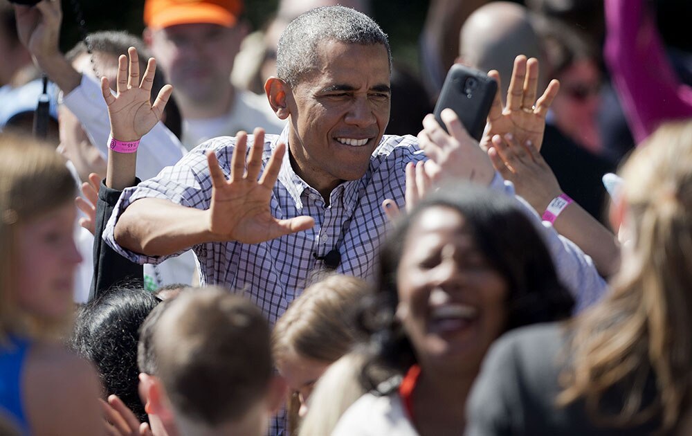 President Barack Obama greets guest during the White House Easter Egg Roll on the South Lawn of White House in Washington.
