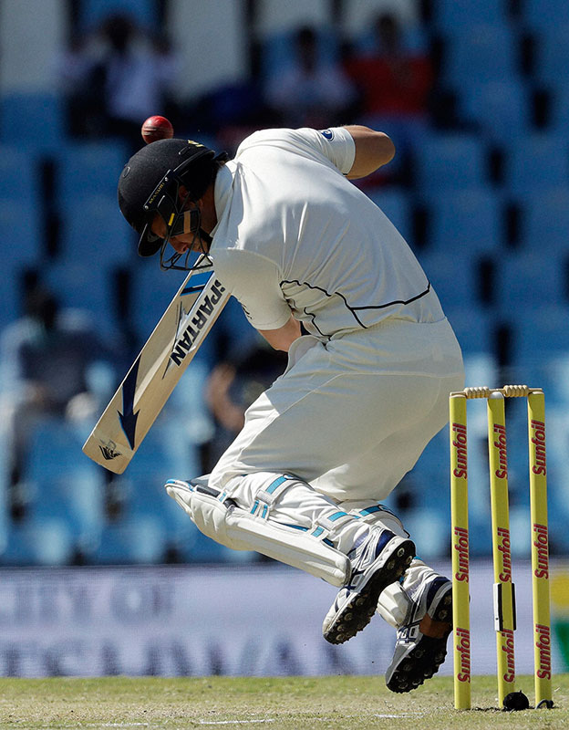 New Zealand`s batsman Neil Wagner, is hit on the helmet by a delivery from South Africa`s bowler Kagiso Rabada on the third day of their second cricket test match