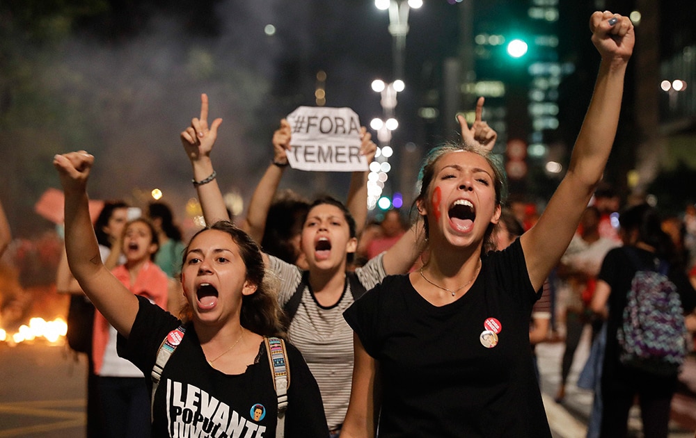 Demonstrators shout slogans against acting Brazils President Michel Temer during a rally in support of Brazils suspended President Dilma Rousseff in Sao Paulo, Brazil