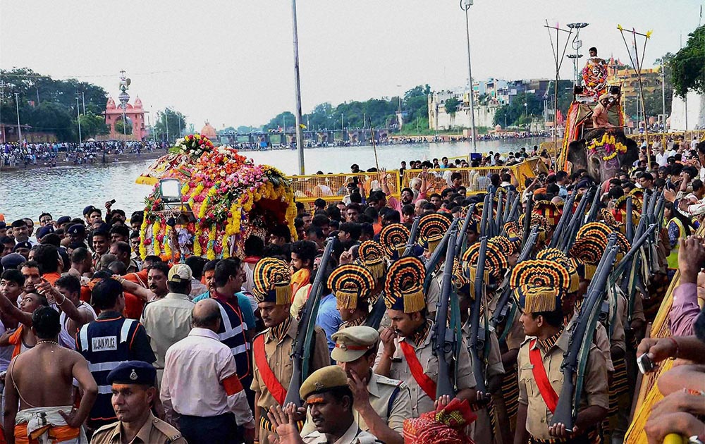 Devotees participating in the royal procession of Lord Mahakal