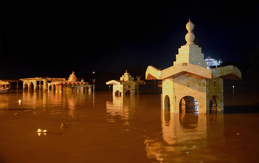 Temples submerged in flooded waters of Narmada river