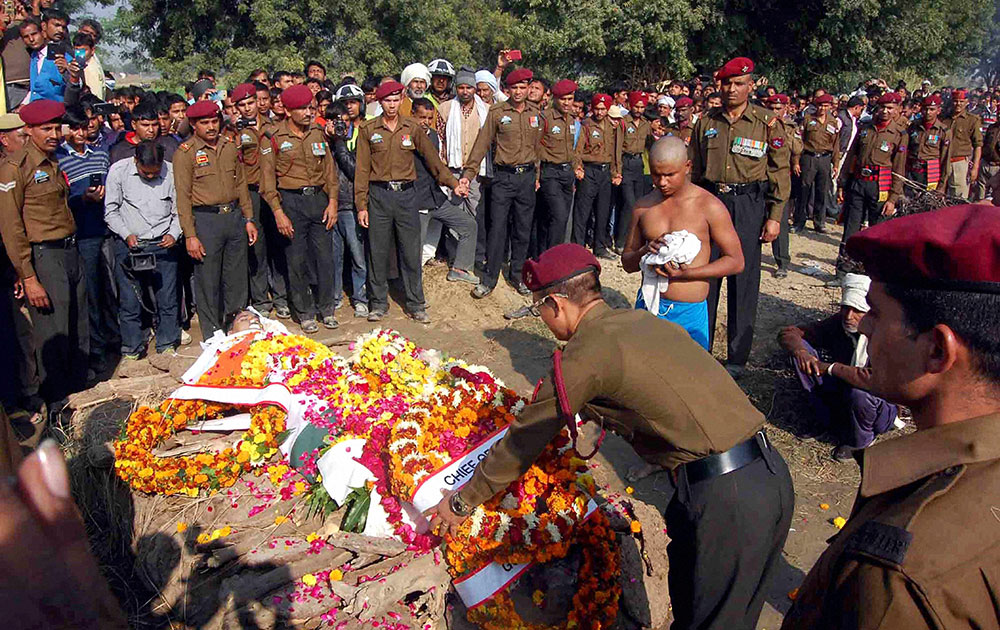 Soldiers paying tribute to Dharmendra Singh who was killed in an encounter with militants in Jammu, at his cremation at village Lohkrera in Agra