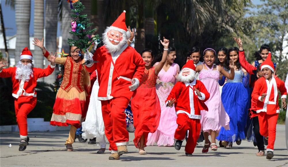 Children enjoying with a Santa Claus