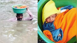 মাথায় গামলার মধ্যে ঘুমোচ্ছে শিশু!গলা জলে দেড় কিলোমিটার সাঁতরে শিশুকে উদ্ধার