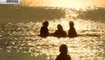 Volunteers distribute bio-degradable carry bags at Gangasagar to keep the waters plastic free