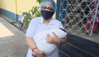 করোনা আবহে মানবিক রেল, সাঁতরাগাছি স্টেশনে পৃথিবীর আলো দেখল শিশু