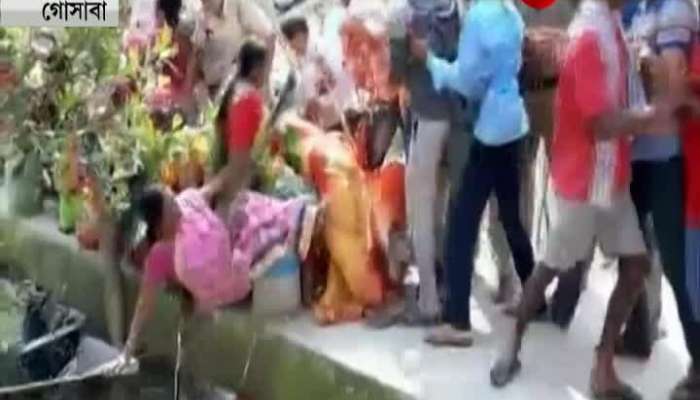 Women falls in water while it got steamy between the police and locals