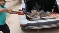 BMW গাড়িতে আবর্জনা বোঝাই করছেন এই ব্যক্তি! কাণ্ড দেখে হা নেটিজেনরা