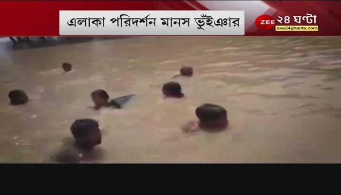 people swimming to get a bit of relief in flood hit ghatal